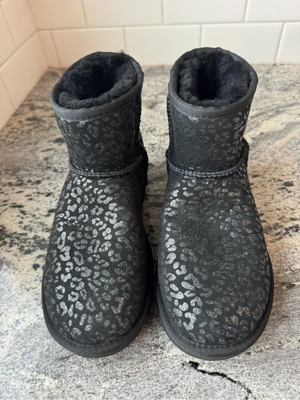 UGG Classic Mini Boot in Black Snow Leopard. Size 6 Youth/ 37 Euro. EUC